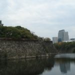 Osaka Castle and its protective moat, with city in distance